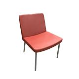 Modern guest chair. Red upholstery & metal frame