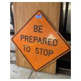orange construction sign 'be prepared to stop' 49