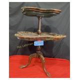 two teir dark ornate table  34 ' tall 25 by w and