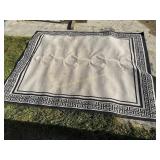 Black and grey outdoor rug,  120' x 92'