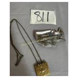 Opened chained locket for 2 small pictures,