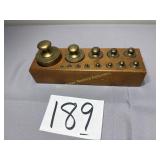 Nested brass balance scale weights