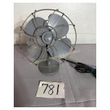 Cast base gray painted electric fan, 9' W x 12' T