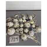 Antique sugar lids with ribbon hangers used as