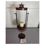 Hurricane candle lantern on metal base, 25' Tall