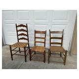 3 Primitive  Wood kitchen chairs, 1 has rattan, 3