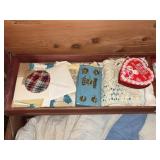 CONTENTS OF CEDAR CHEST:QUILT, DOILIES, BABY SHOES