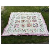WHITE & PINK QUILT W/ FLORAL PATTERN (EDGES APPEAR