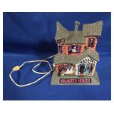 VINTAGE PLASTIC PLUG IN HAUNTED HOUSE APPROX 7"