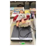 Samsung theater system, doll,  blanket