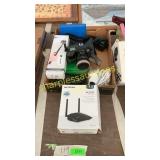 Netgear router, Nikon F70, Fujifilm camera