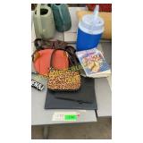 Purses, cooler, assorted books