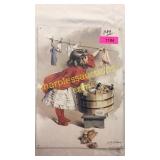 Metal sign - girl hanging laundry
