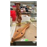 Musical instrument, wooden statue