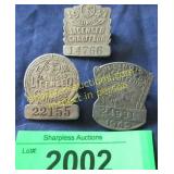 Three vintage badges