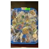 Tray of necklaces in bags