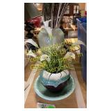 Vases and bowl with arrangements