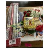 Assorted gift wrap, cards, boxes, stockings