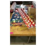 Gift wrap, boxes, & blow up Catboy w/ wreath