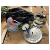 Assorted lids for pans, exerciser, bag of clothes