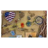 Assorted jewelry, pins, cuff links,