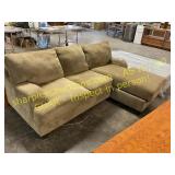 Upholstered tan sofa