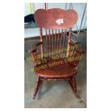 Rocking chair - reddish in color