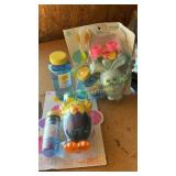 Two bubble blowers, bottle of bubbles