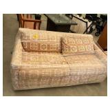 Upholstered sofa on wheels