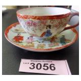 Vintage hand painted Oriental cup and saucer