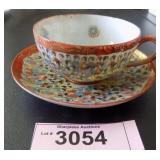 Vintage hand painted Oriental cup and saucer
