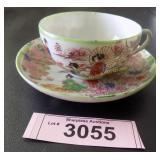 Vintage hand painted Oriental cup and saucer