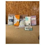5 phone cases, 1 pill organizer