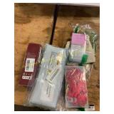 Body oil, pendants, press-on nails, and battery