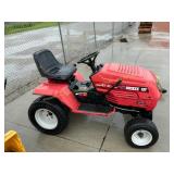 Husked riding mower