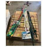 Fence post, broom, yard sticks, mop