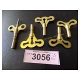Five antique clock keys