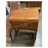 Sewing machine cabinet