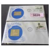 Two 14k gold stamps US 1st Day Issue Original