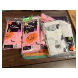 Assorted paper table covers and candy bag