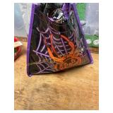 Halloween goodie bag, cat ears, water bottle, hand