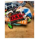 Assorted costumes, signs and table cloths