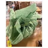 Green plastic table cloth? (Damaged)