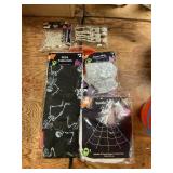 Spider webs, rings, skeleton garland, tablecloths