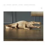 Alligator gold statue broke leg