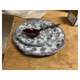 Plastic plates, red metal spoon