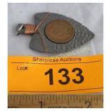 Indian head penny in arrowhead medallion