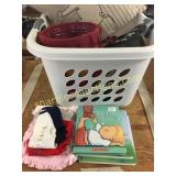 Laundry basket, books, baby clothes