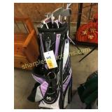 Purple golf bag w/ clubs