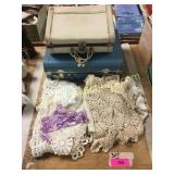 Suitcase, doilies